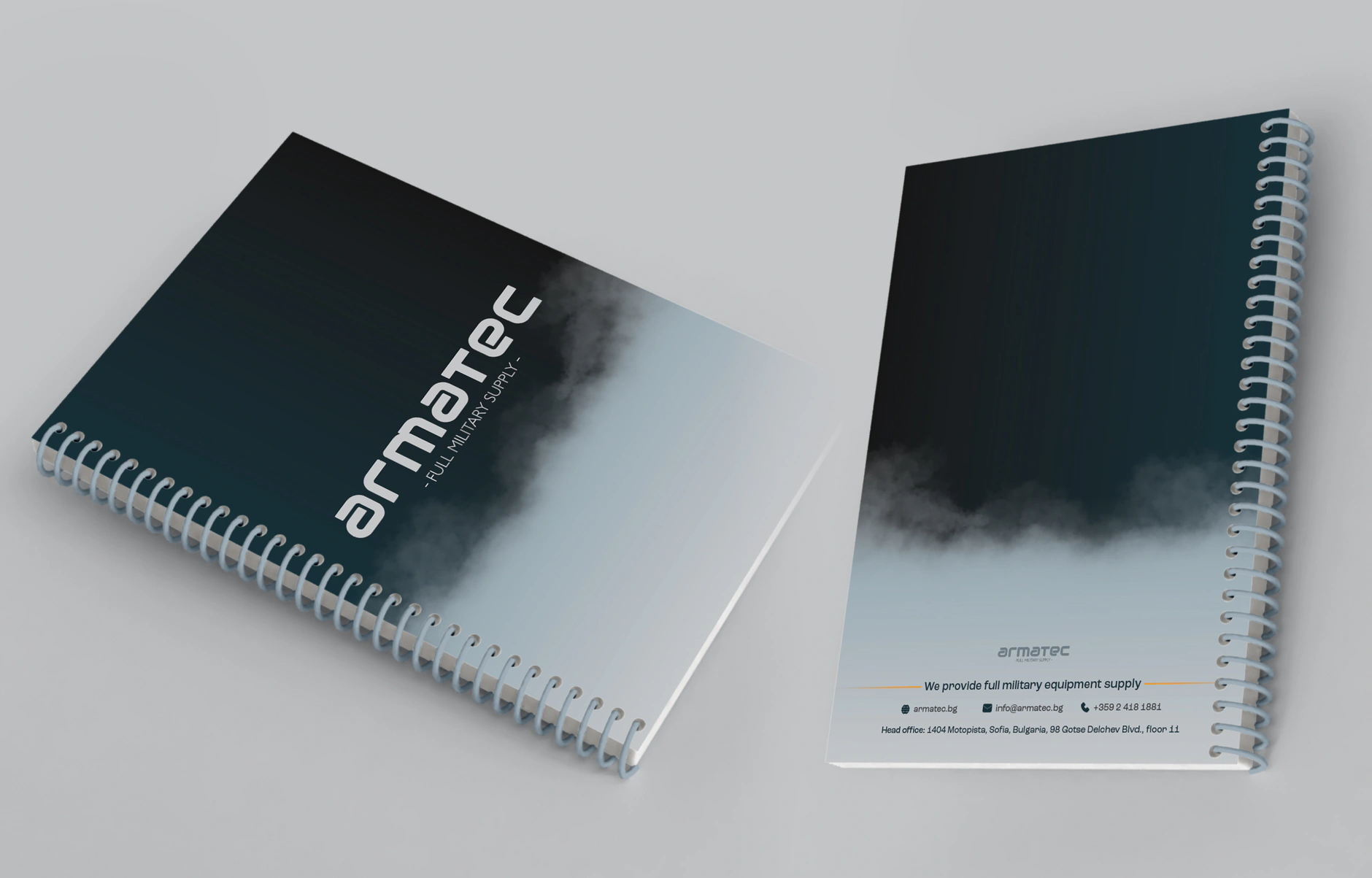 Armatec spiral-bound notebooks with the logo on a smoke-gradient cover and contact details on the back
