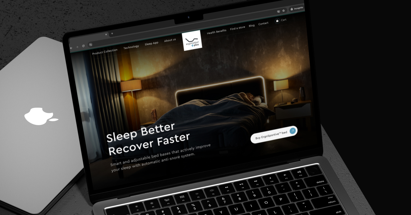 The Ergomotion Plus website on a laptop