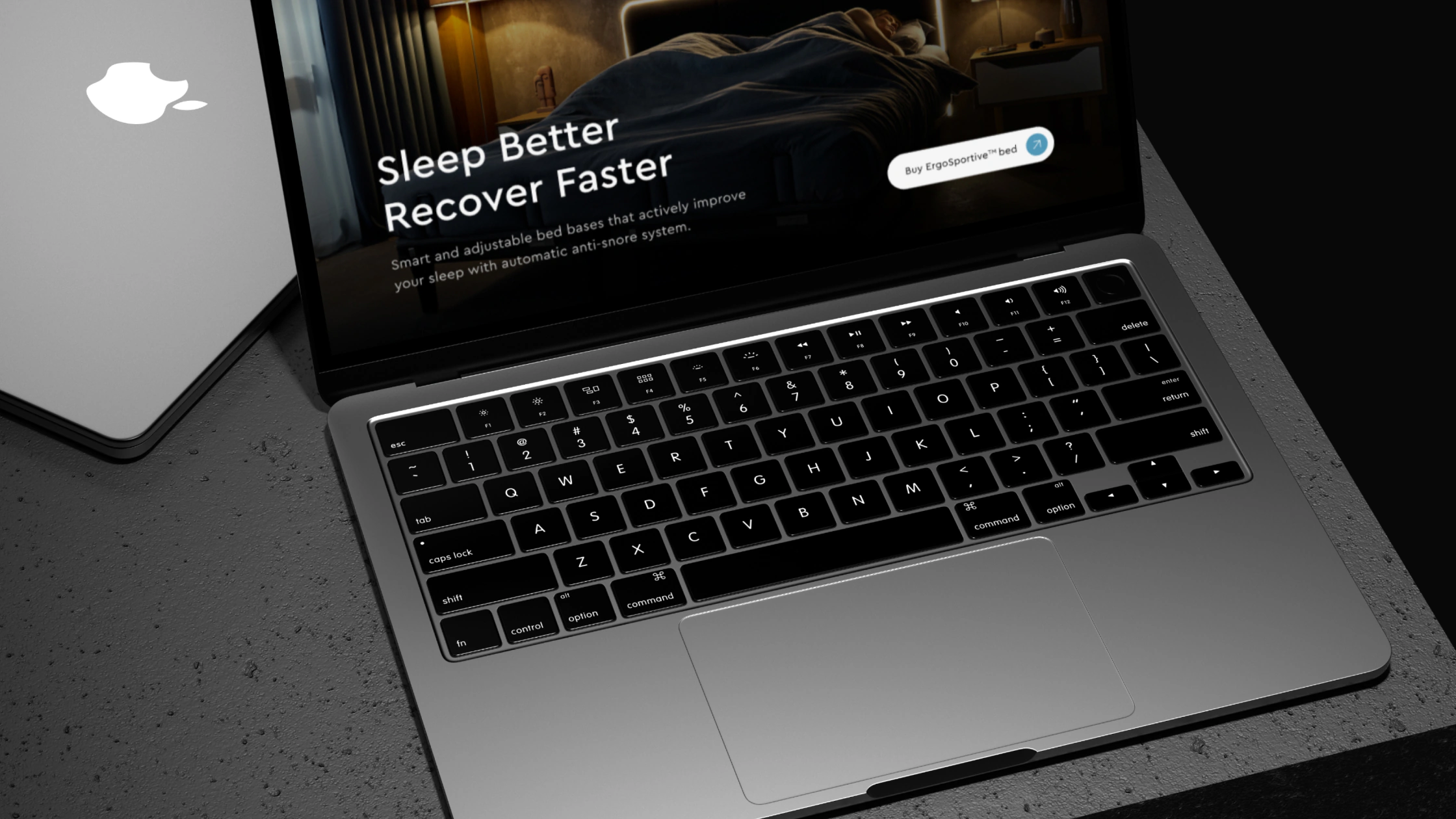 The Ergomotion Plus website on a laptop