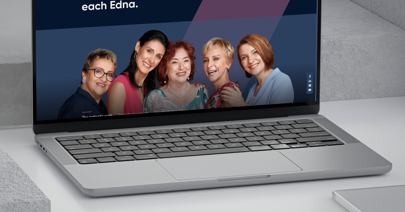 The One of 8 website on a laptop