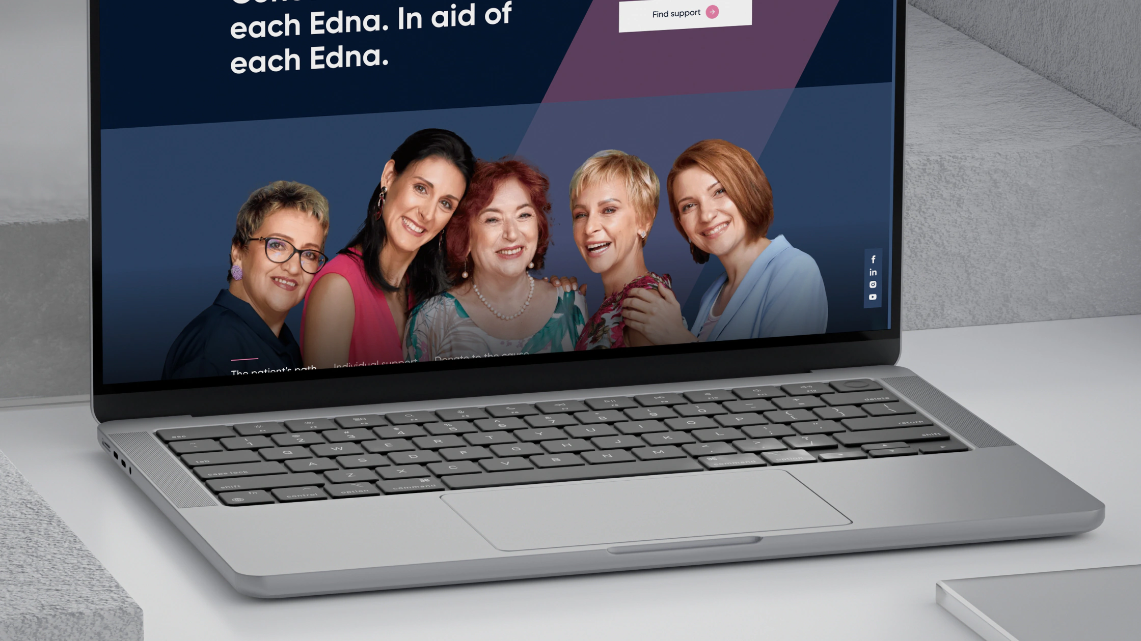 The One of 8 website on a laptop