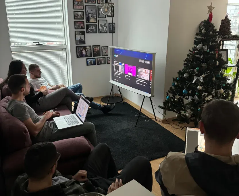 The Creative Corner team watching an educational Webflow video together in the office.